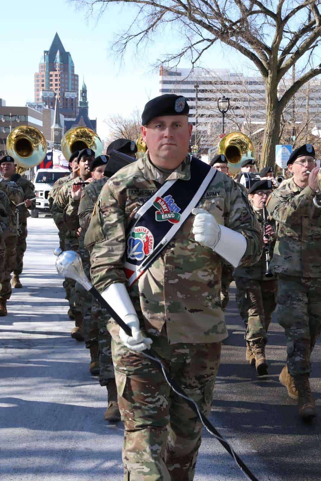 Staff Sergeant Jeff Kazmierski, 484th Army Band, leads a former Vets Day Parade; image for a Veterans Day 2022 blog post